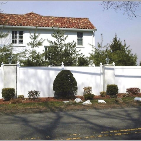Custom white PVC fencing for privacy from a road