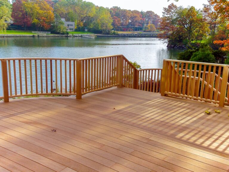 wooden deck and railing overlooking lake