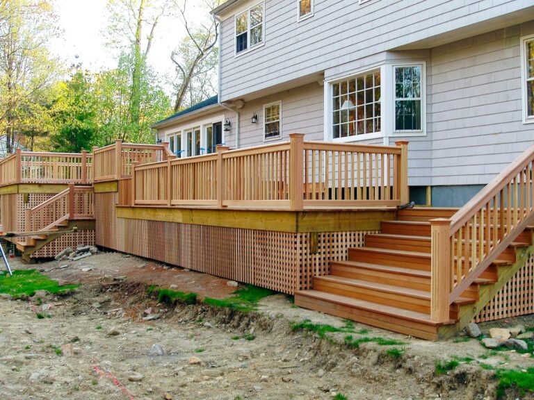 The lattice paneling adds additional interest to the deck that wraps around this home.