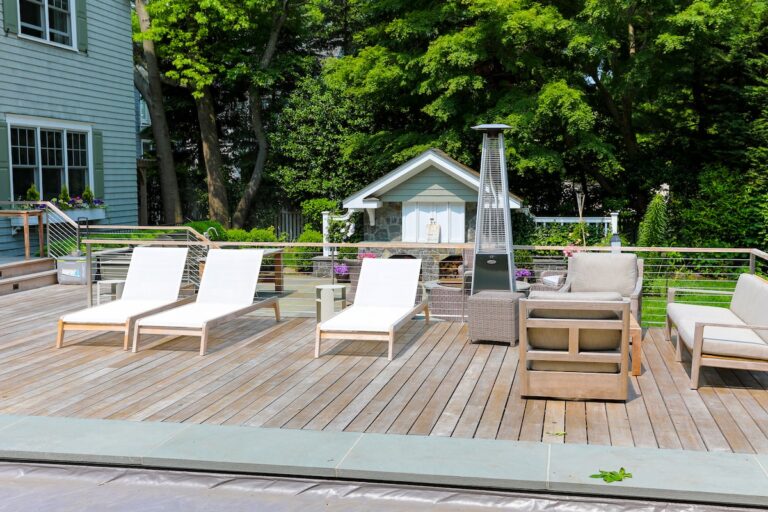 This wide open deck with mixed wood and steel cable railings provides plenty of space for furniture.