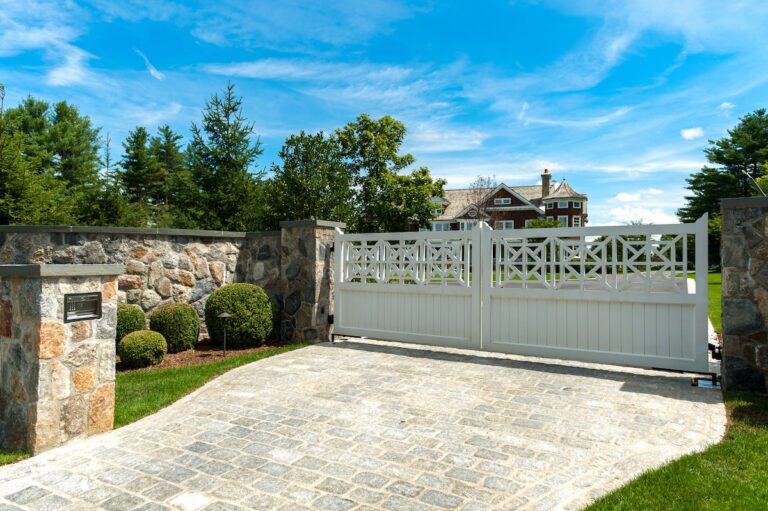 white wooden driveway gate with design