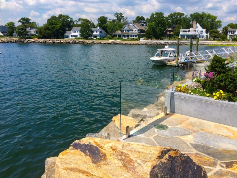Glass railing panels leave the harbor view unobstructed.