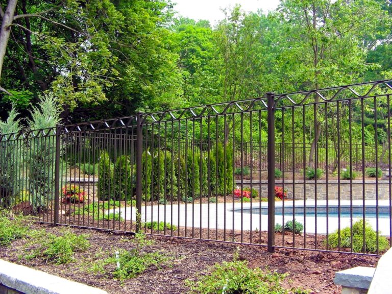 simple black metal pool fencing with decoration