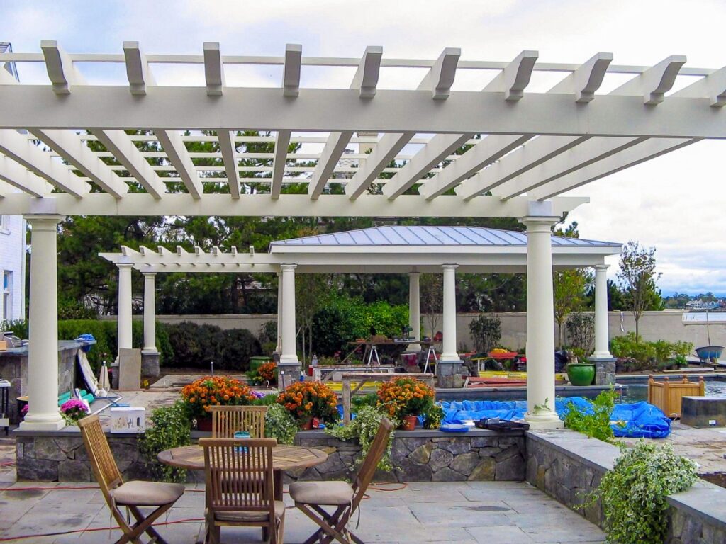 White pergola with a copper roof