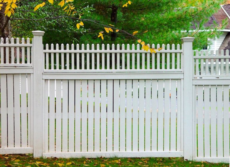 white privacy fence with spacing between slats