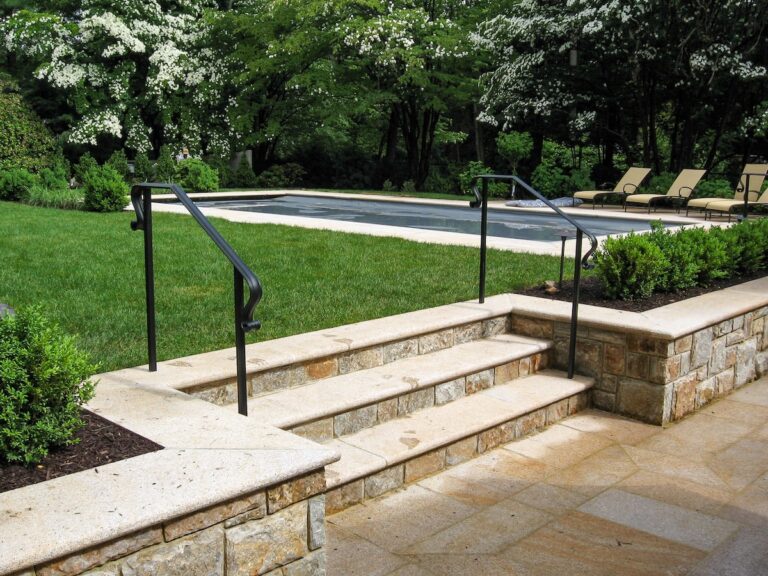 outdoor stone stairs with metal rail