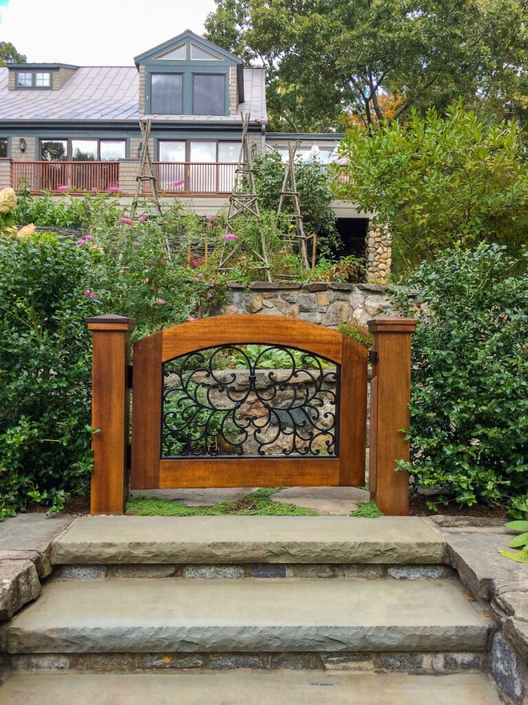 swinging wood walk gate with metal design