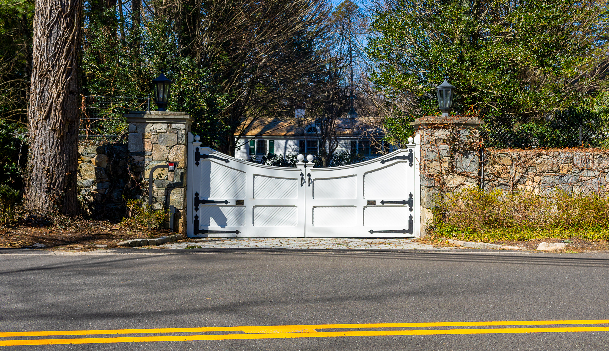 bold driveway gate with metal hardware