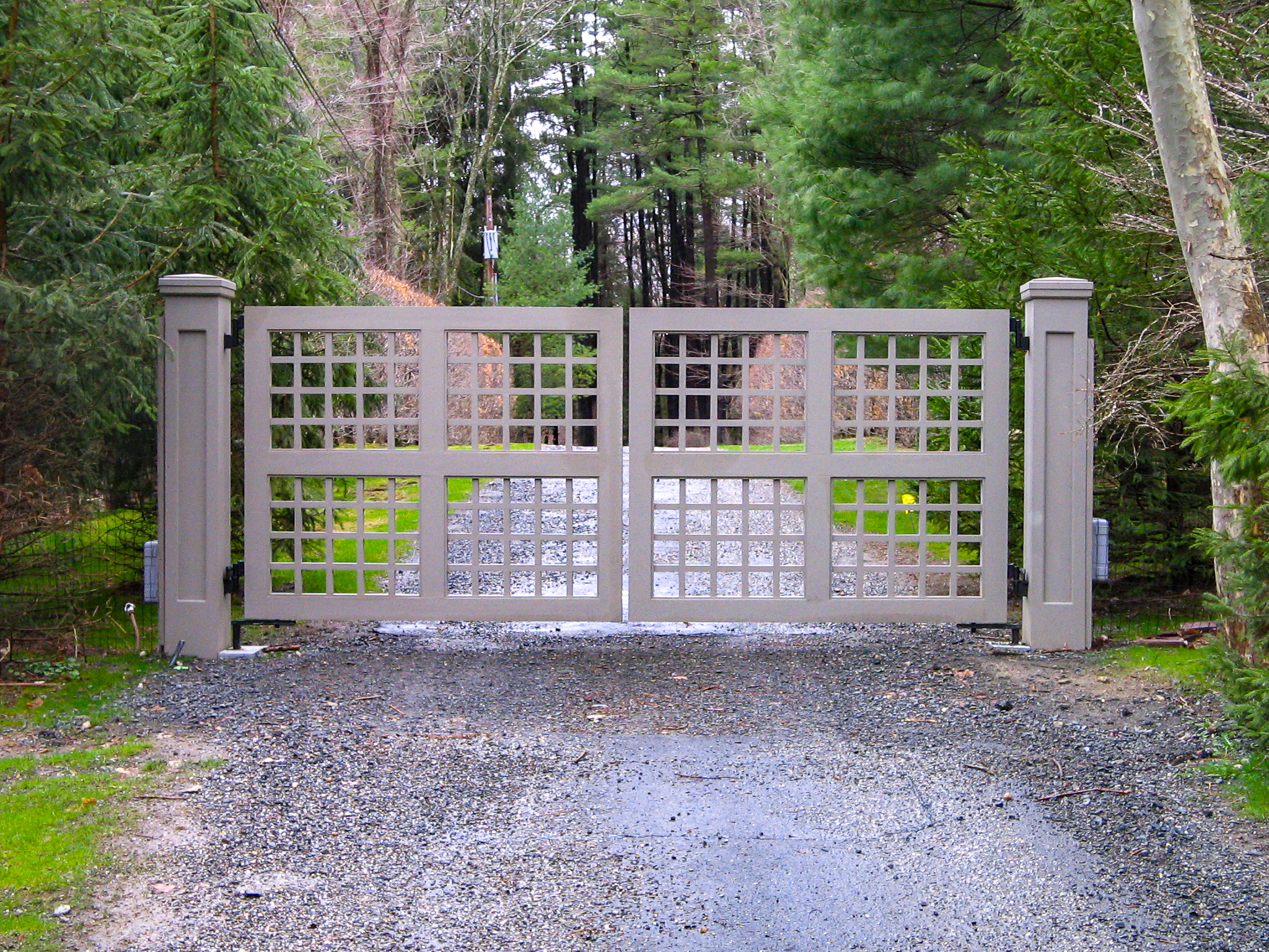 modern driveway gate made from composite materials for longevity