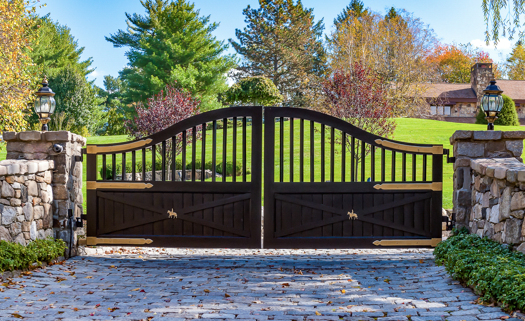 country driveway gate ideas with custom hardware in farmhouse setting