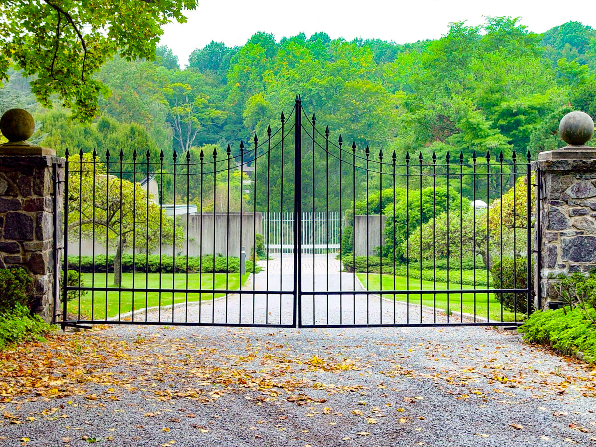 wrought iron metal driveway gate with picket top