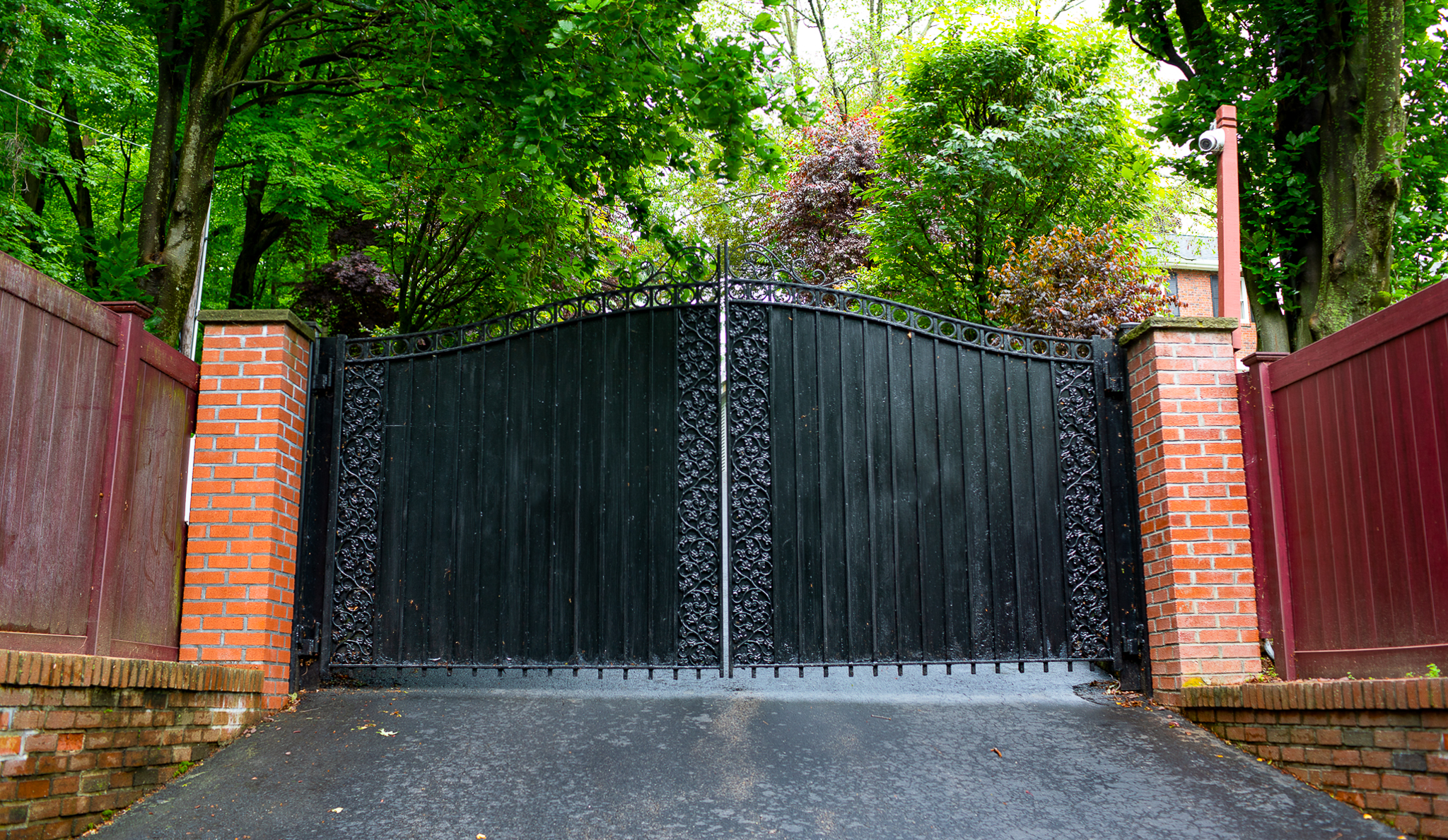 Tall, black driveway gate for optimal privacy