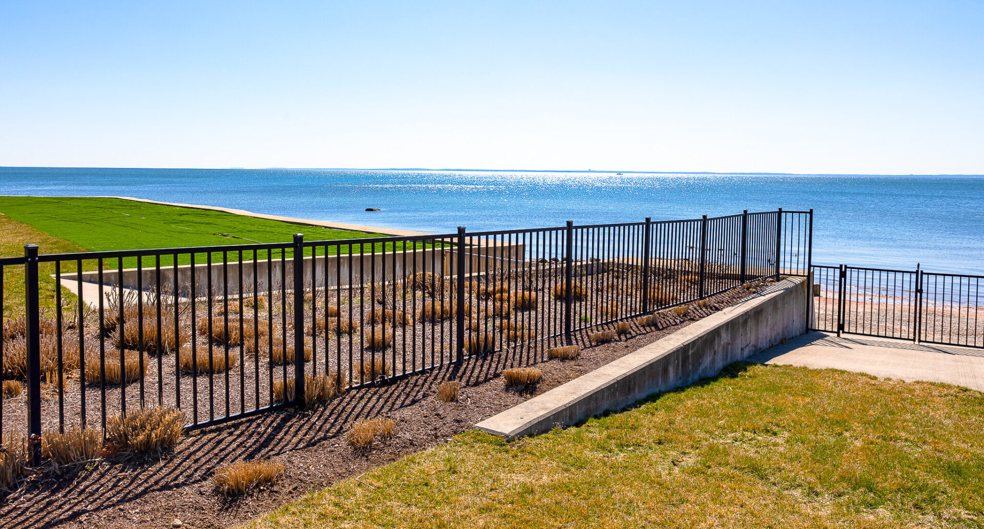 aluminum backyard fencing with an ocean view