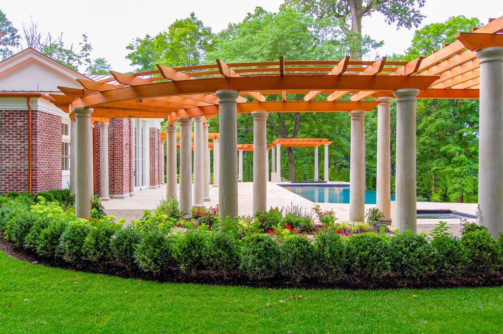 Curved wood pergola with white columns