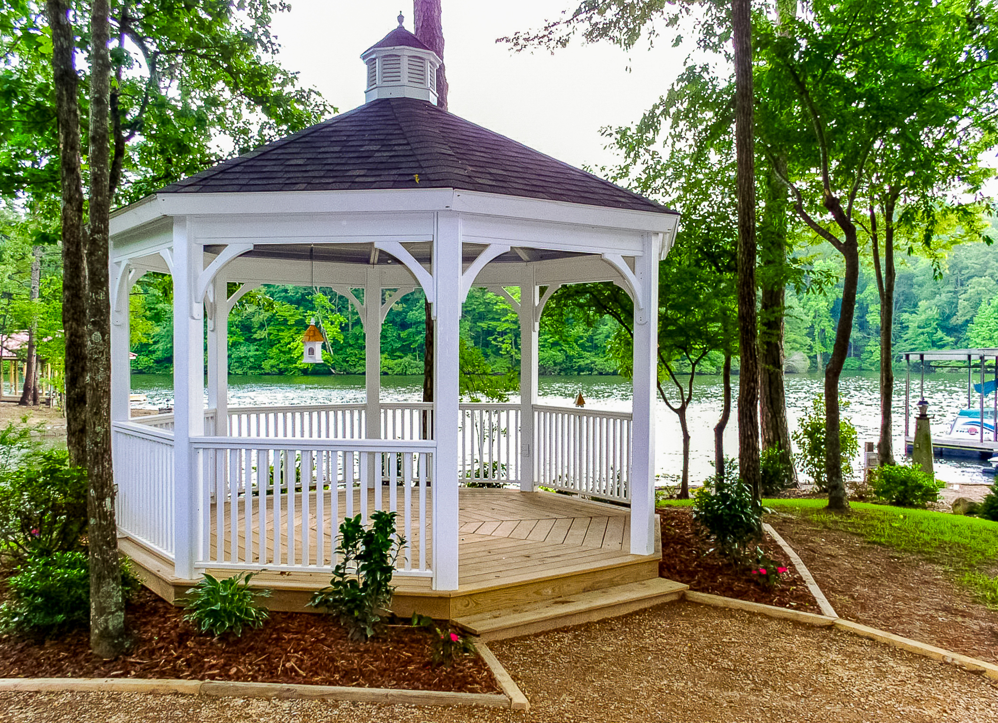 white custom gazebo installed near a lake setting