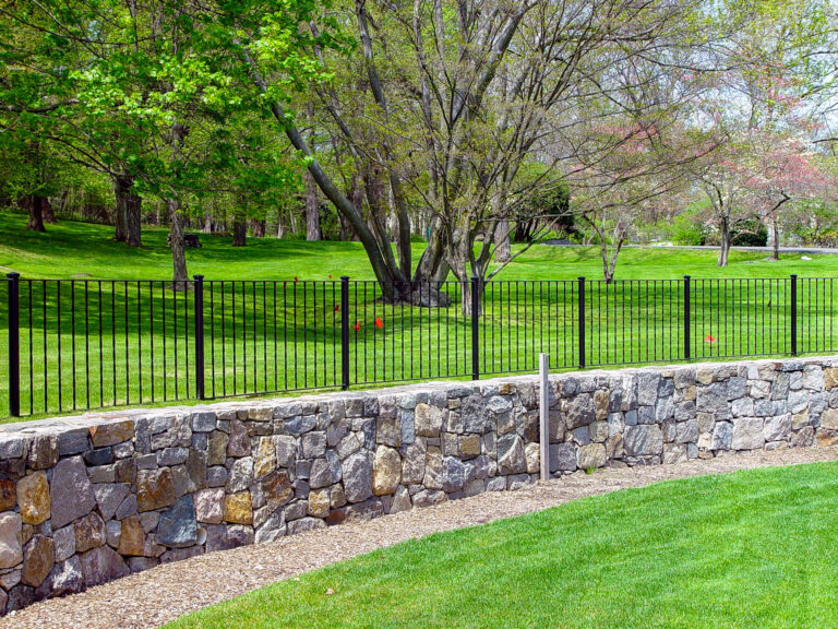 strone retaining wall fence made with black metal
