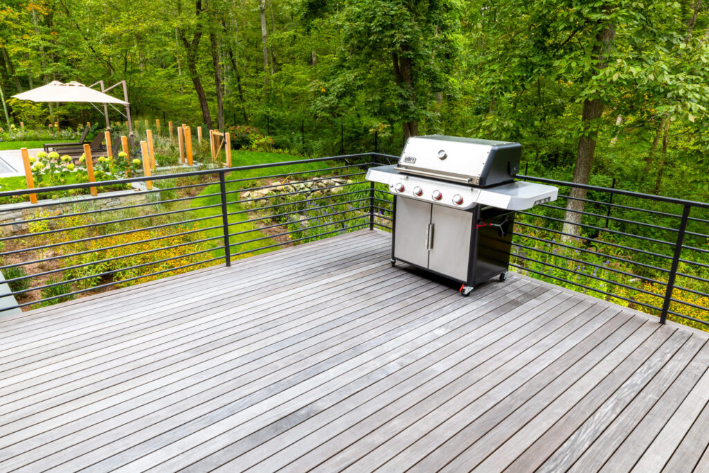 backyard deck and grill with horizontal railing for safety