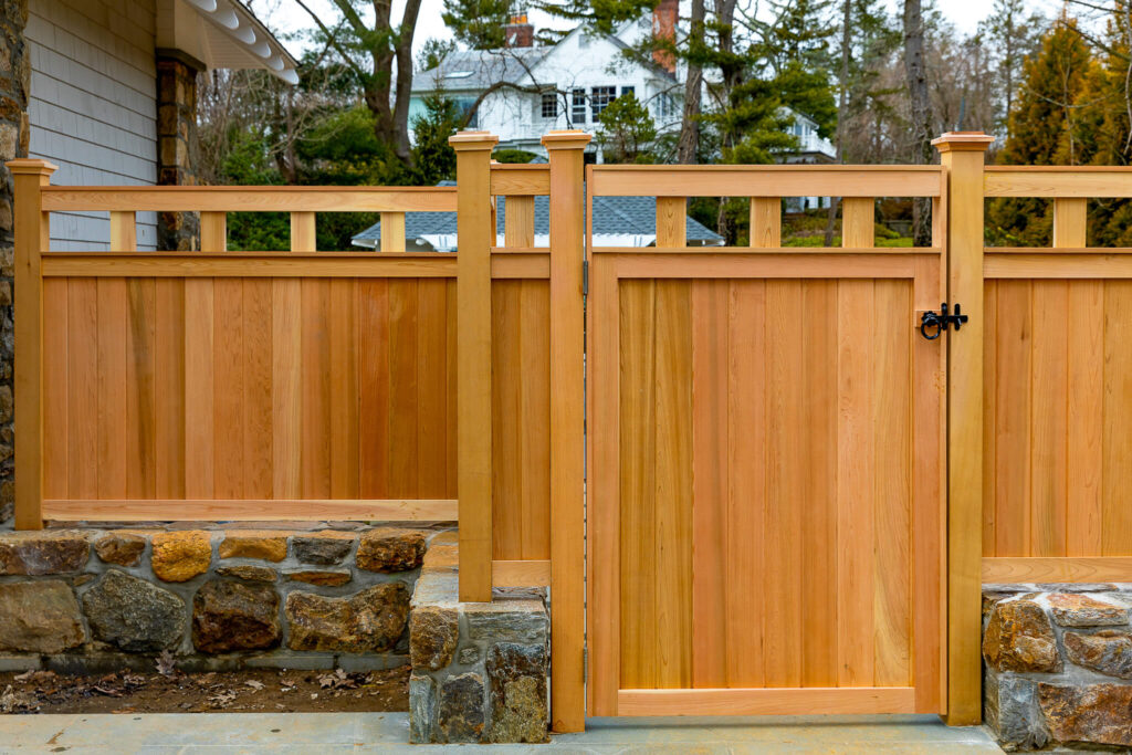 cedar wood privacy fencing with a walk gate into the backyard