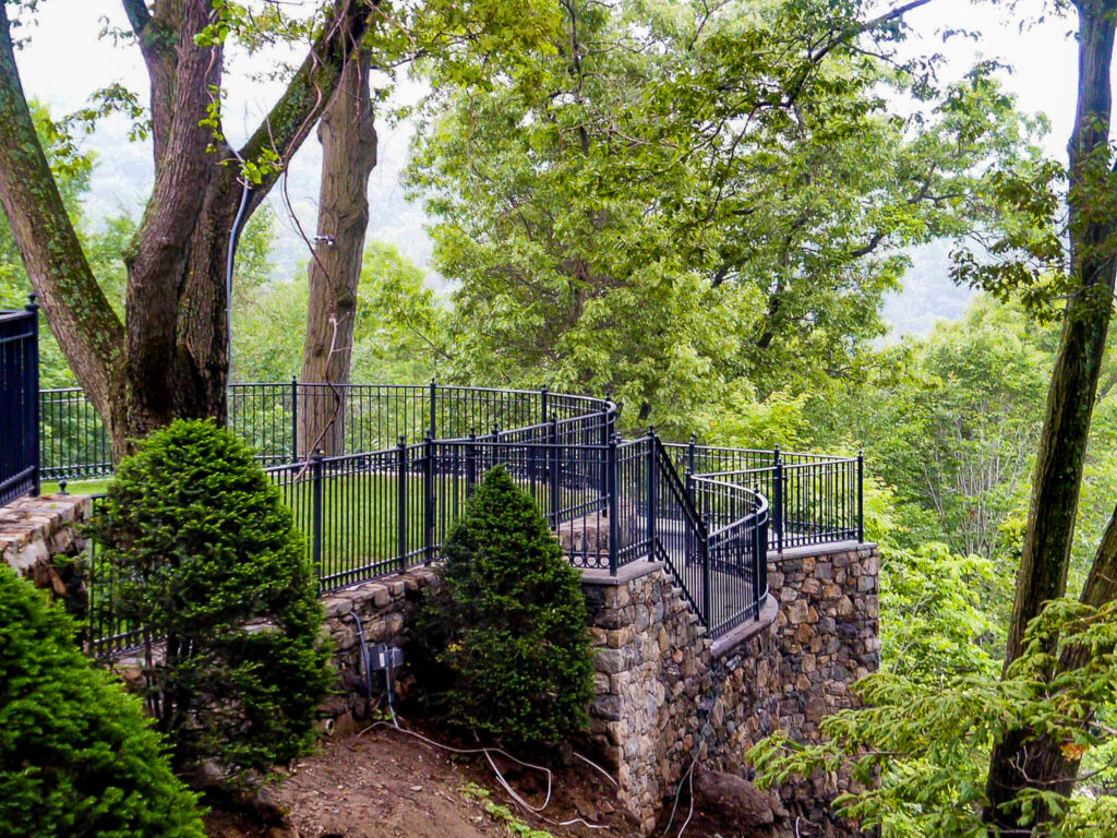 metal fencing and railing on a stone staircase and overlook
