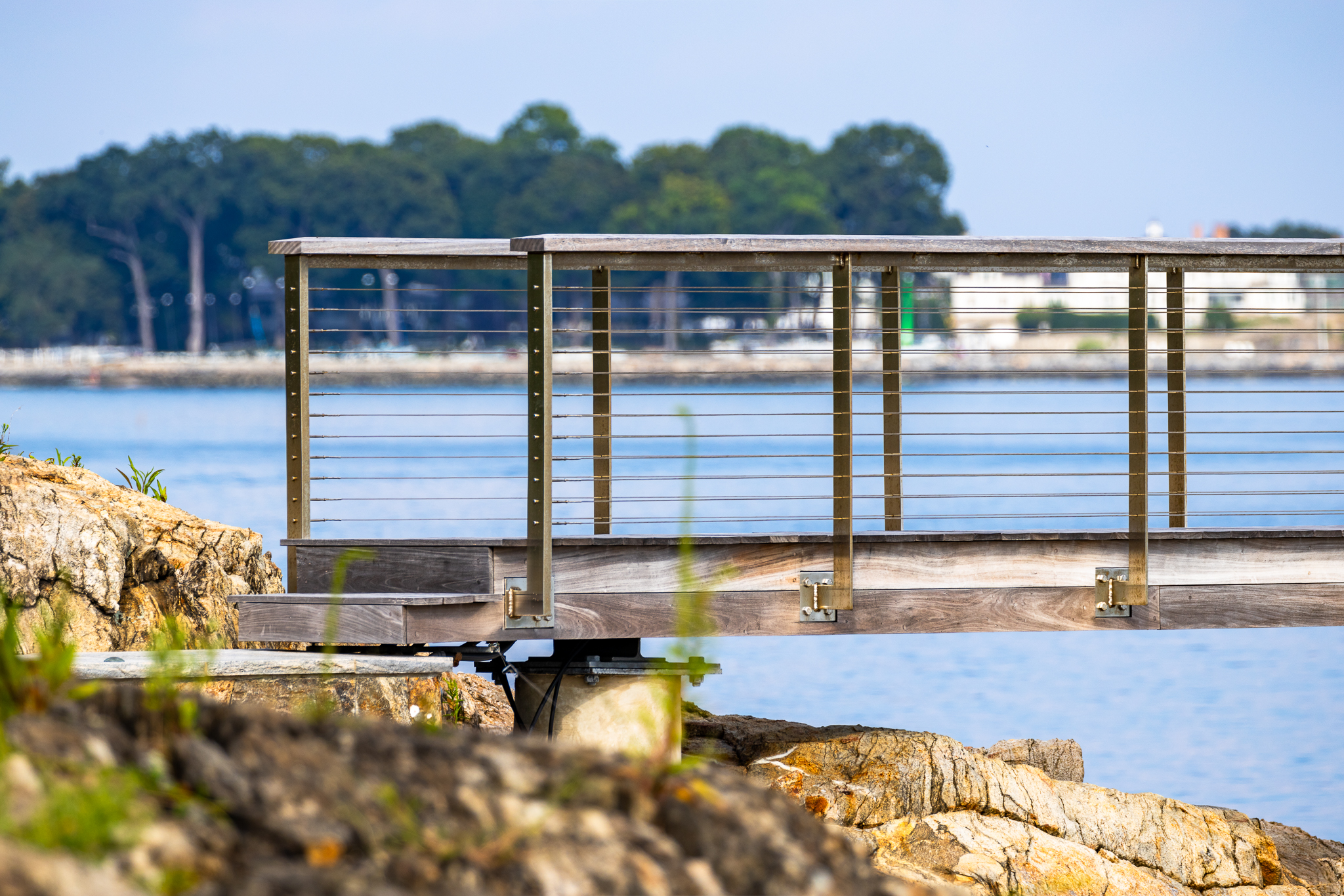 Stainless bridge fence railing with cables along the coast