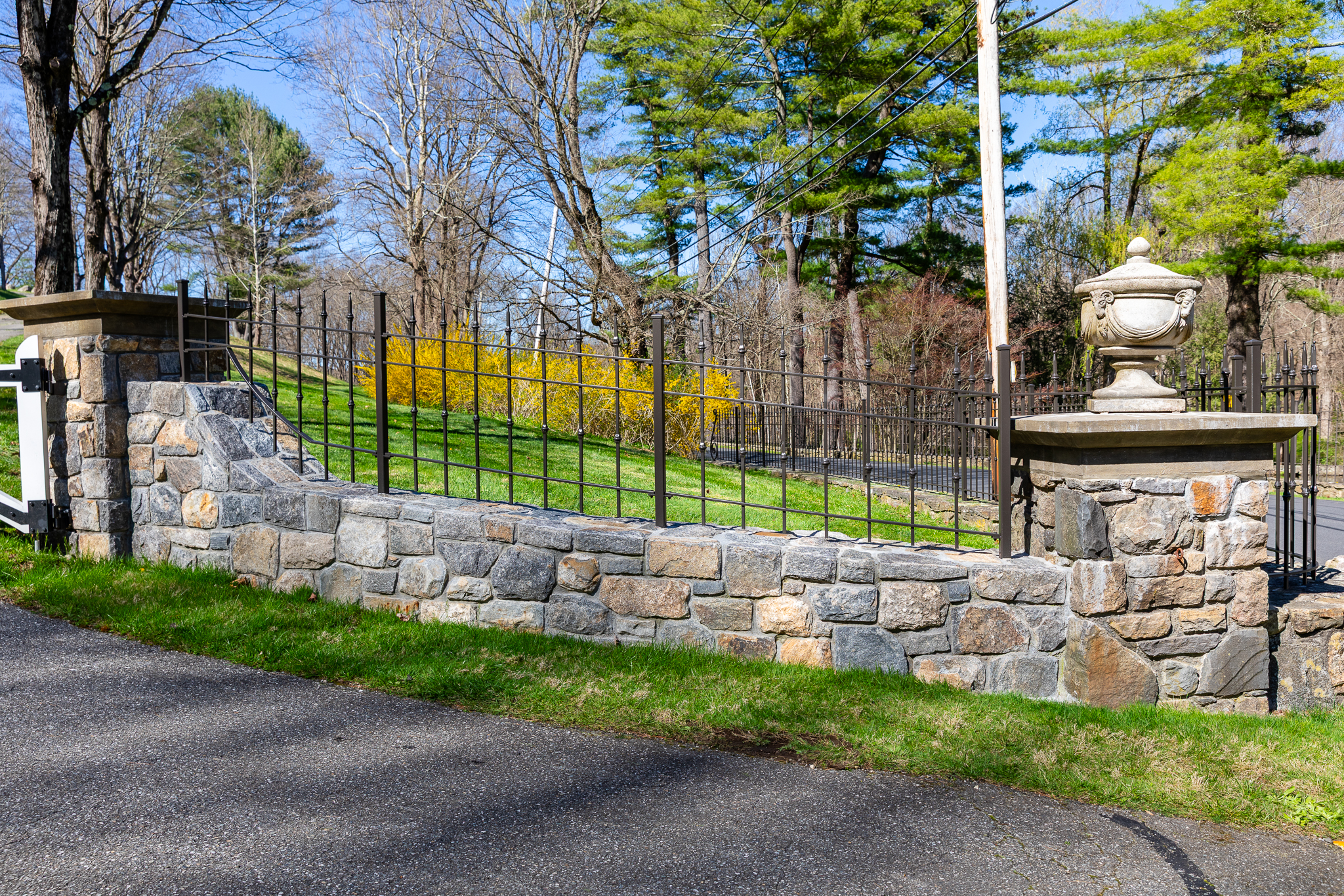 Stunning Security Fence Installation on Stone Wall Entryway