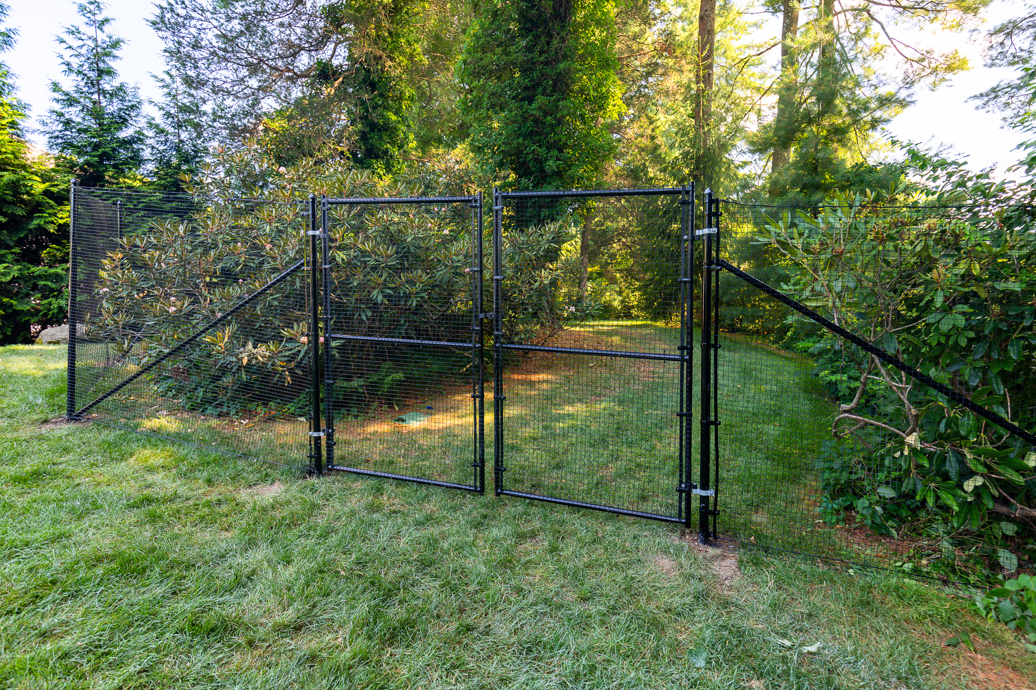 Tall Deer Fence with Walk Gate Has a Height of About 8 Feet