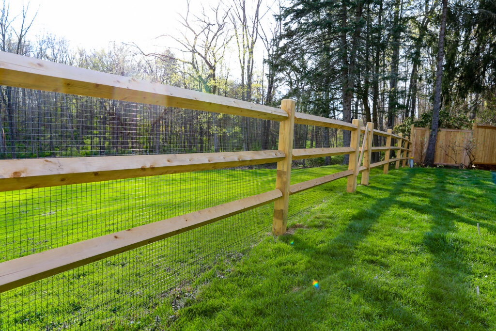 Cedar Post and Rail Fence with Mesh to Contain Animals
