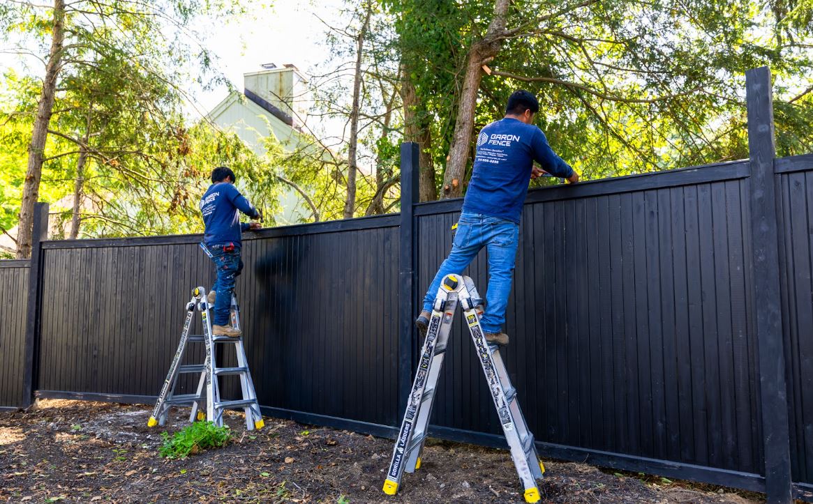 Black Backyard Security Fence Installation by Garon Fence